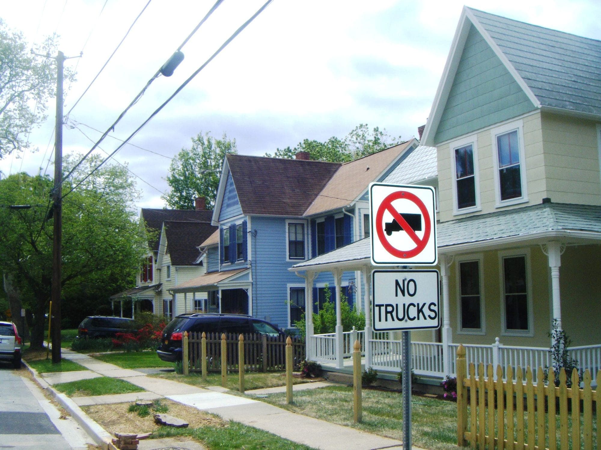 Colorful Victorian houses with picket fences on Armory Avenue in Kensington, Maryland