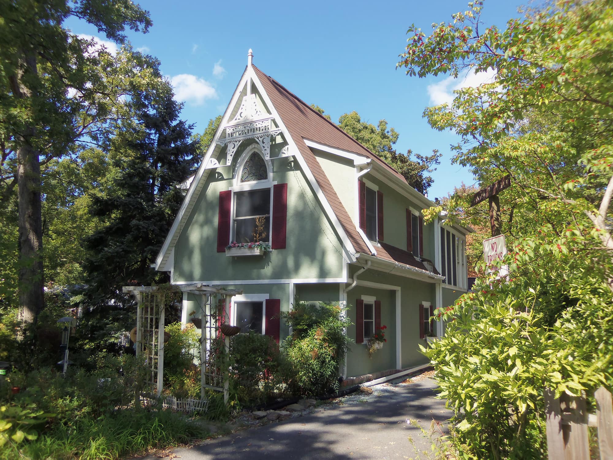 A green gingerbread-trimmed Victorian cottage in the Washington Grove Historic District, Maryland
